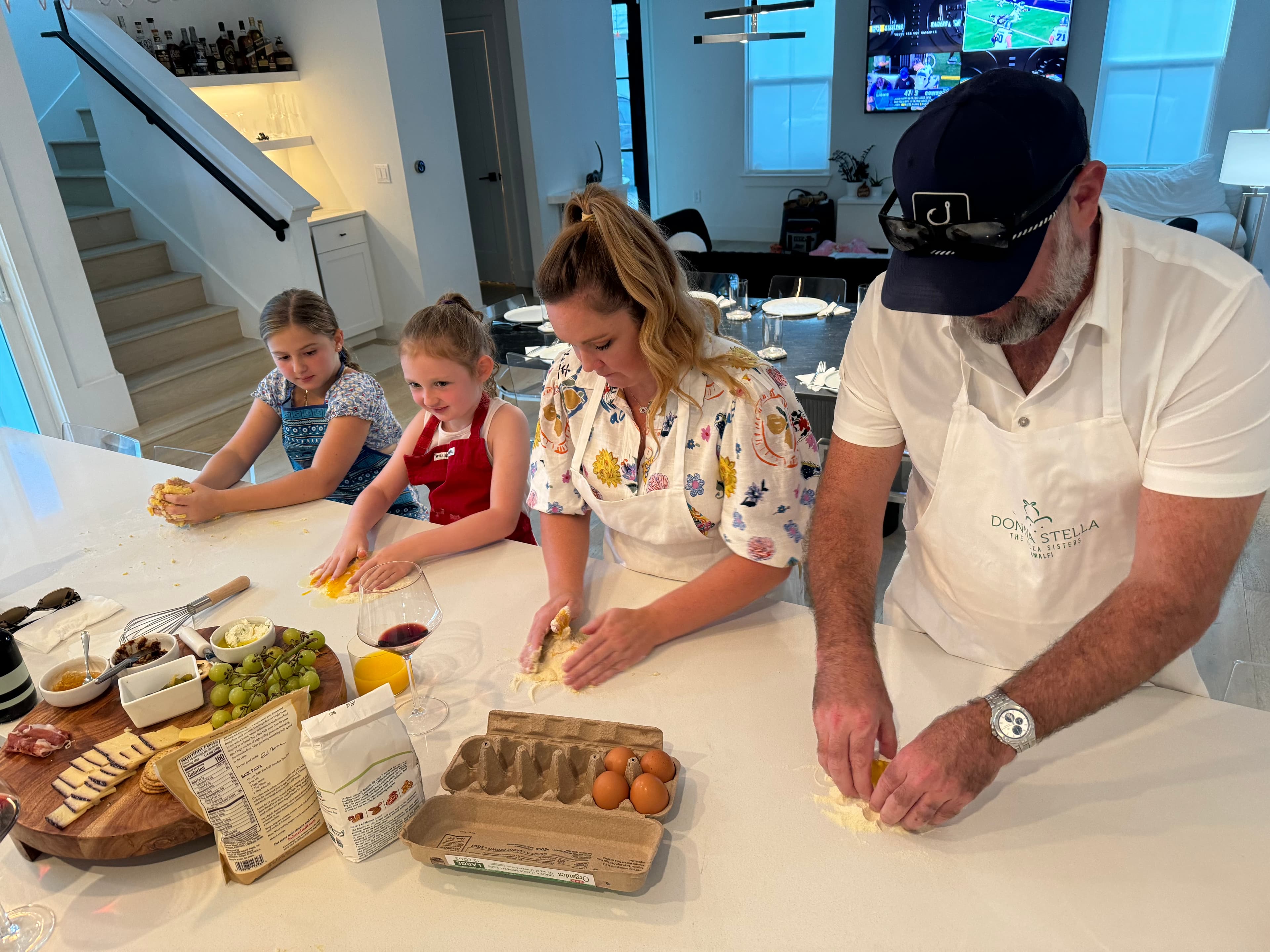 Family gathered around the table laughing and eating